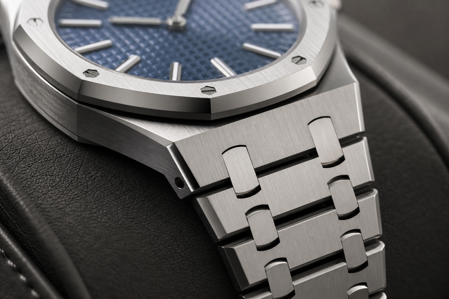 Close up of brushed and polished finishing on a Royal Oak style steel watch bracelet